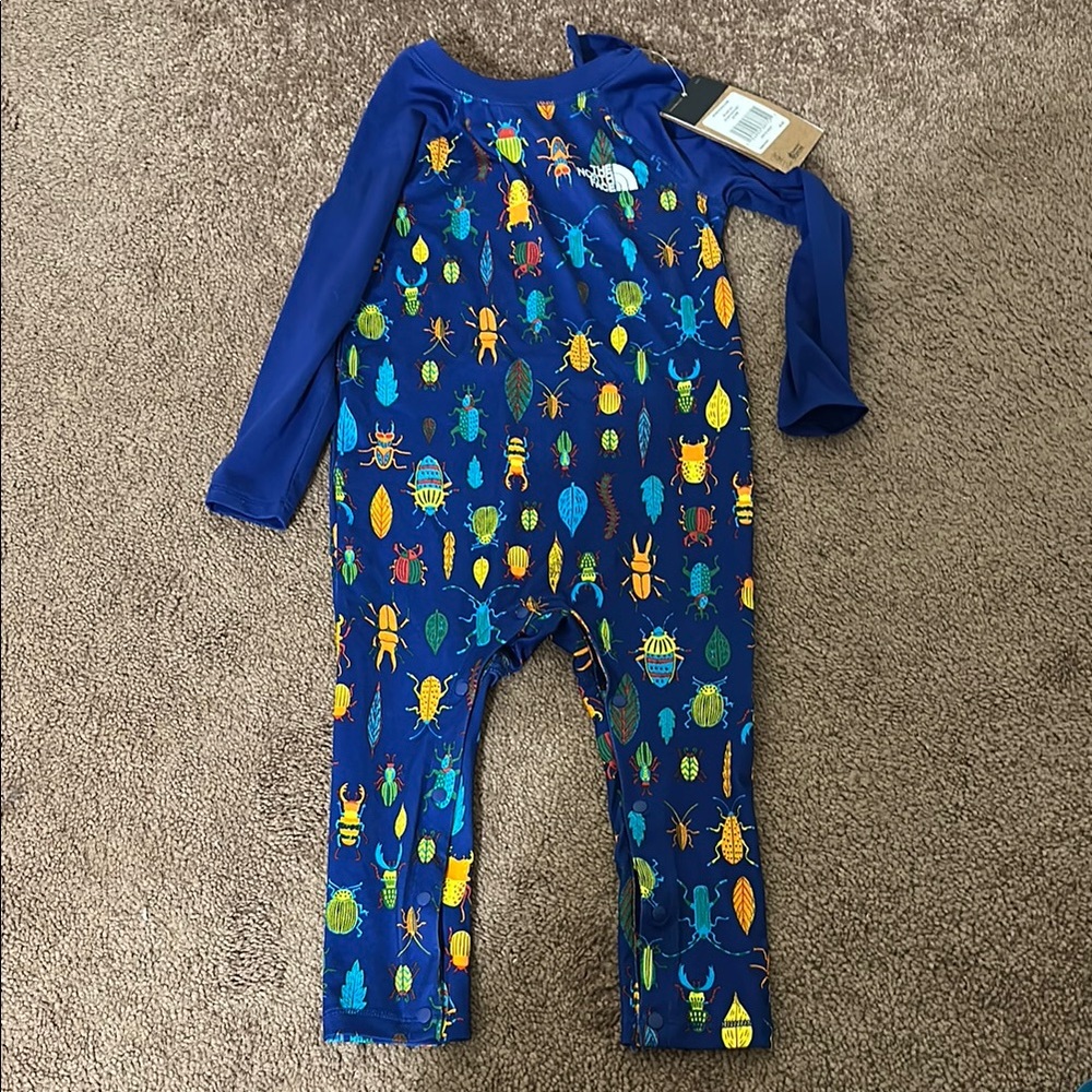 The North Face Blue Bodysuit with Playful Pineapple Print